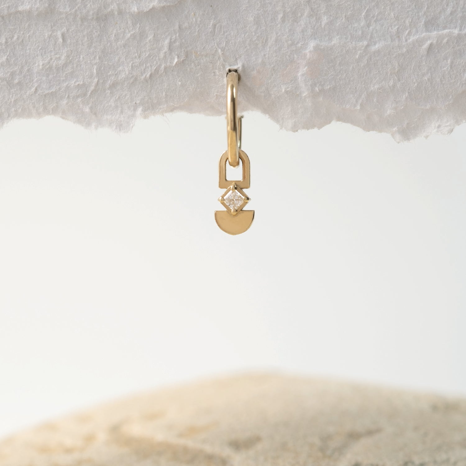 Earth hoop earring in a square